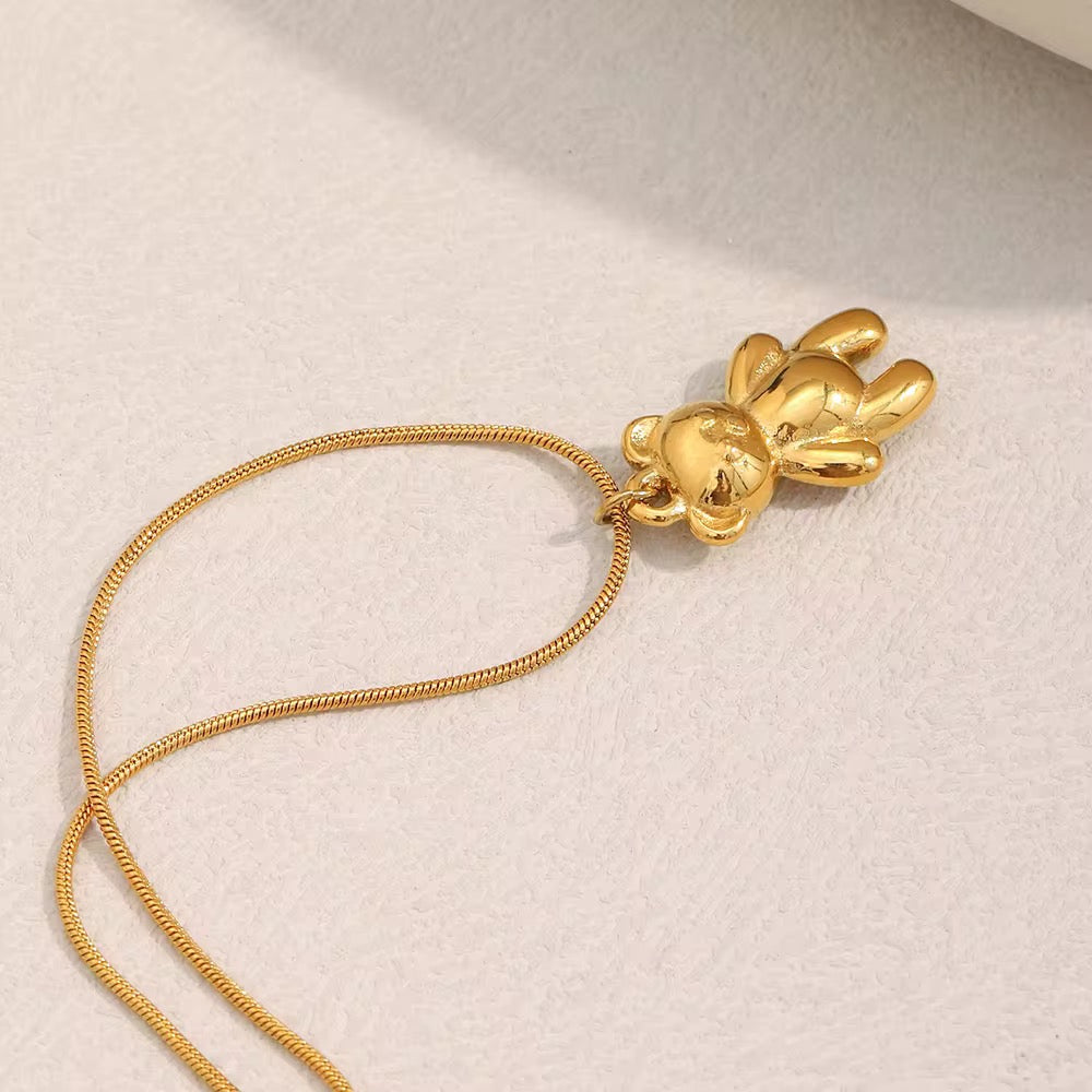 Collana dorata con catena doppia e ciondolo orsetto lucido